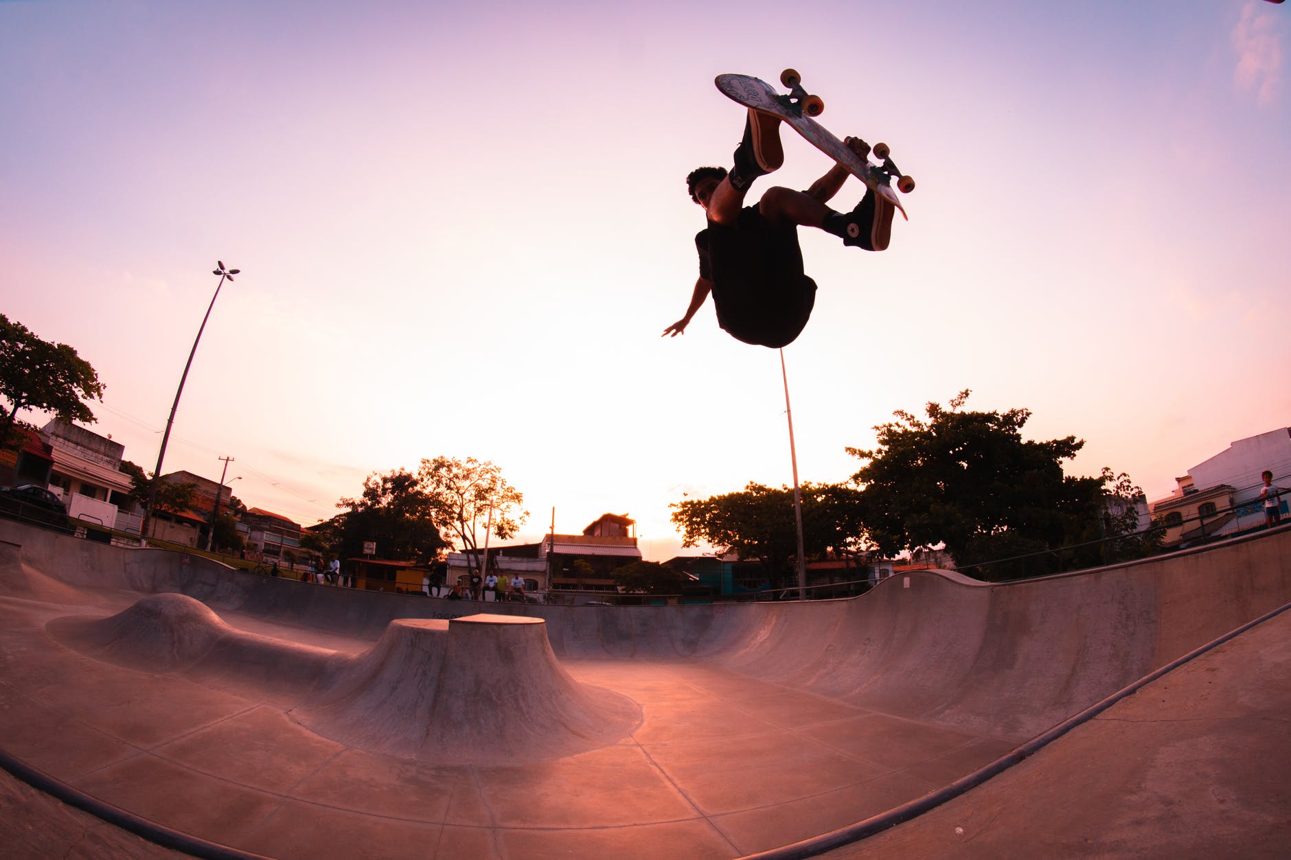 a guy doing a trick in the bowl